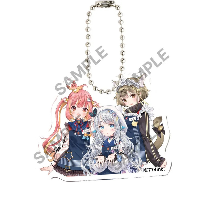 3人のアニメキャラクターが描かれたキーホルダーの画像。中央のキャラクターは白いフードをかぶり、左のキャラクターはピンクの髪、右のキャラクターは茶色の髪をしている。