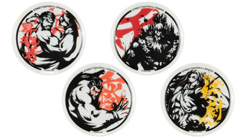 ストリートファイター6のキャラクターが描かれた、4つの丸いコースターのセット。各コースターには、キャラクターのイラストと「STREET FIGHTER 6 x GRAPHT」のロゴが描かれています。
