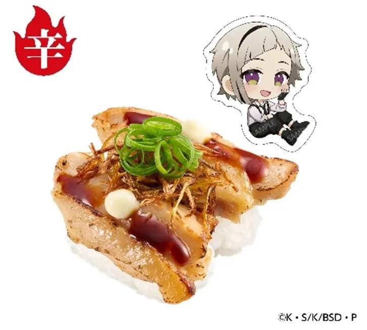 辛味マークとアニメキャラクターのチャームが添えられた寿司。
