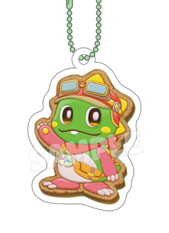 カエルを模したキーホルダーのイラストです。カエルはゴーグルと帽子を被り、ピンク色の手袋と靴を履いています。